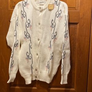 Cardigan with embroidery accents.